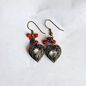 Gold tone and white crystal heart earrings